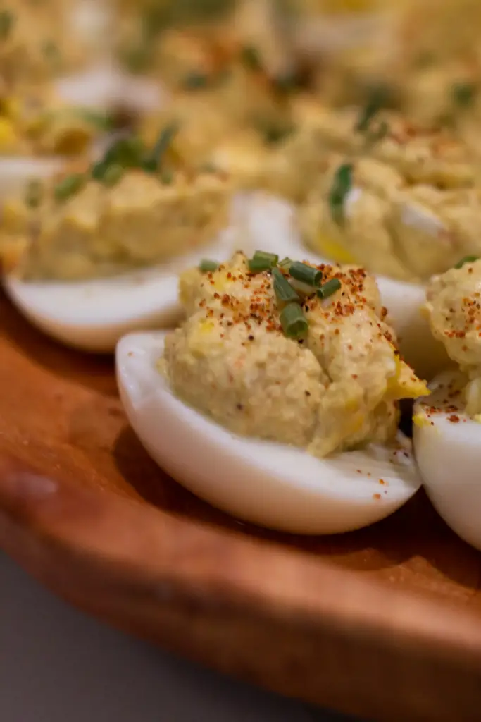 Shrimp dip deviled eggs make the perfect appetizer for any occasion, and are sure to be a hit. Shrimped-up deviled eggs get stuffed with a mixture of cream cheese, mayonnaise, shrimp and seasonings before being chilled and served.
These easy deviled eggs are a great appetizer when you need a simple yet tasty recipe. They can be made in minutes and make a quick snack or light meal. I like them because there is no mayo involved, just good old, boiled eggs, that’s how I do it!