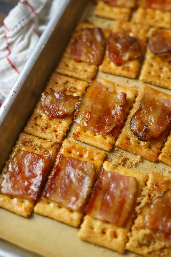 Make irresistible bacon crackers with bacon, brown sugar, a tiny bite of cayenne pepper and buttery crackers. Perfect for any gathering or snack time!