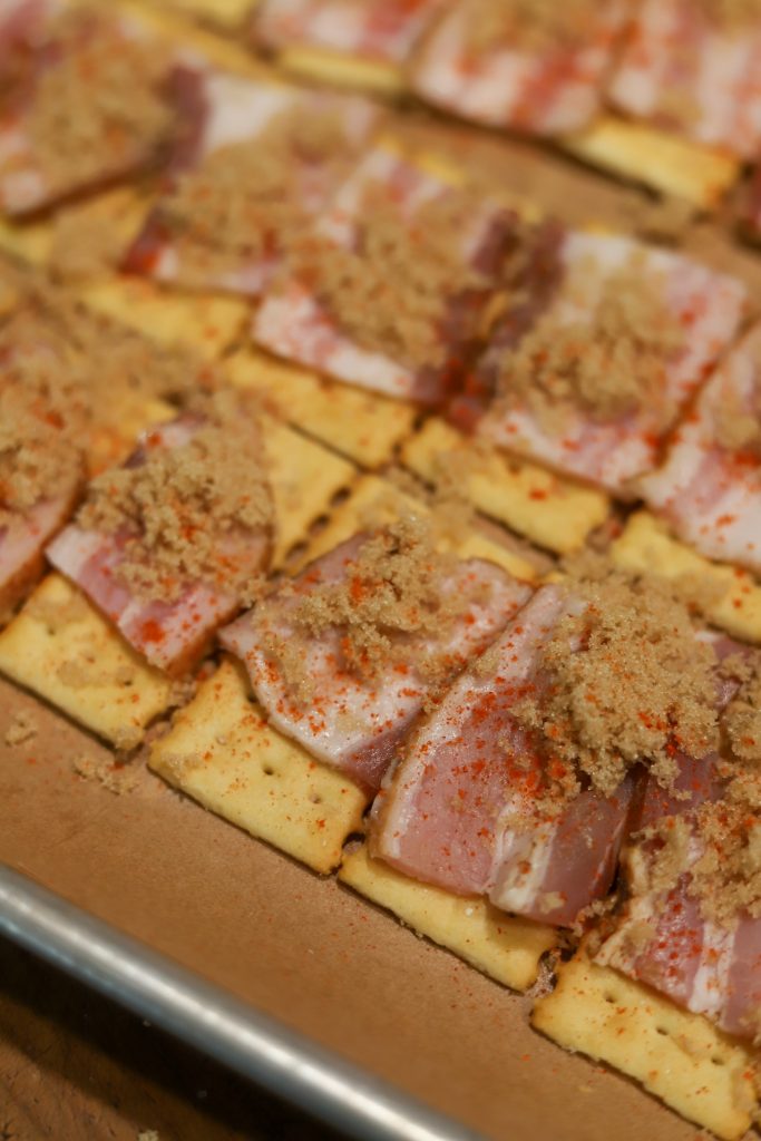 Make irresistible bacon crackers with bacon, brown sugar, a tiny bite of cayenne pepper and buttery crackers. Perfect for any gathering or snack time!