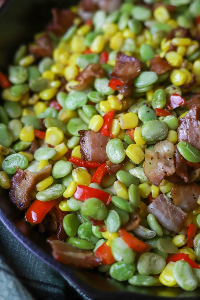 Make a delicious succotash recipe, combining seasonal vegetables and savory bacon for a perfect side dish.