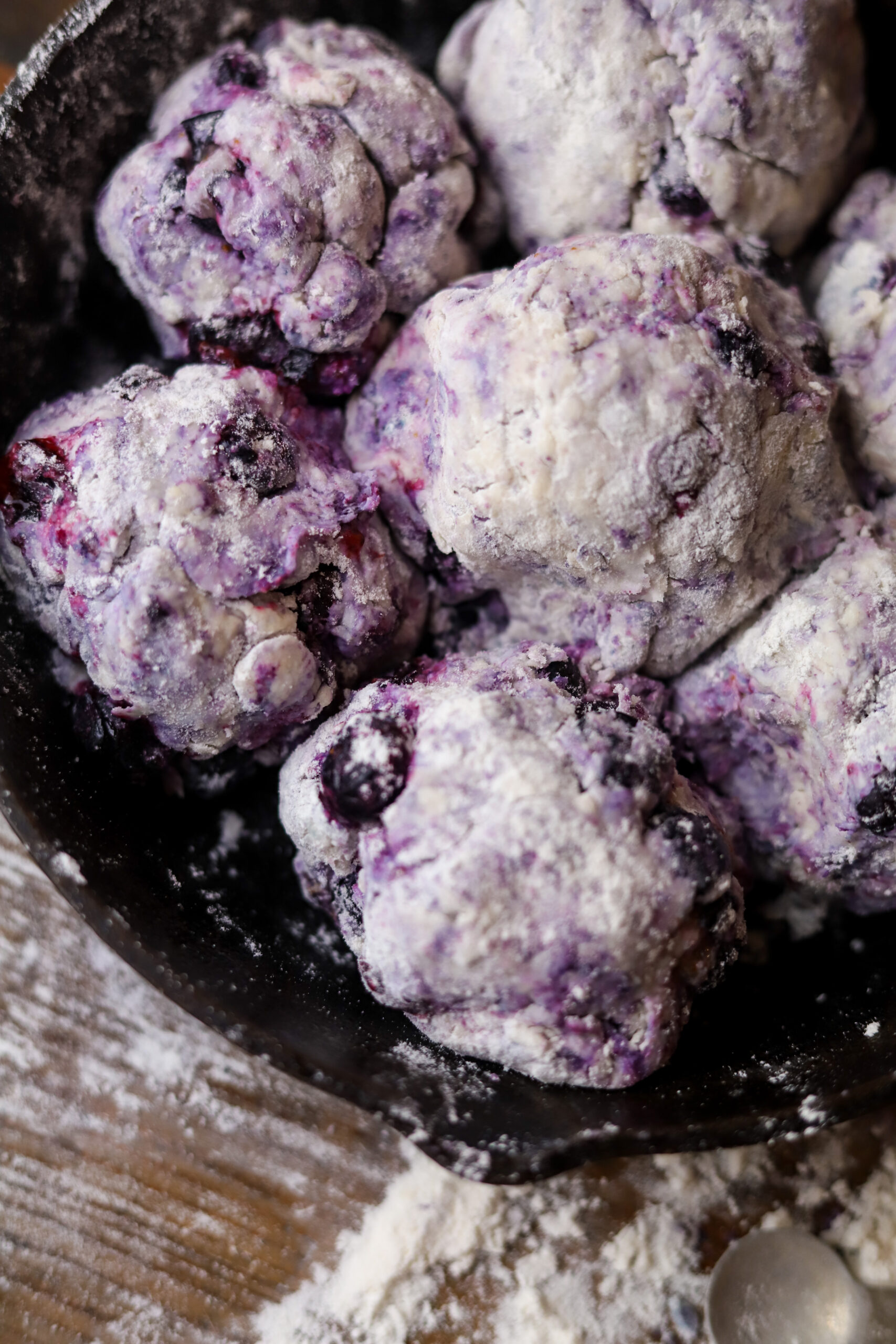 These country blueberry biscuits are literally so delicious and easy to make. I feel like these are really the old-fashioned way to make cathead biscuits. Instead of butter, you'll use shortening then mix together your flour, baking soda, sugar, and of course buttermilk. Knead them all together with some frozen blueberries into balls and bake them in a skillet with some melted butter for about 20 minutes until golden brown. These are the perfect breakfast or perfect for even just a snack. 