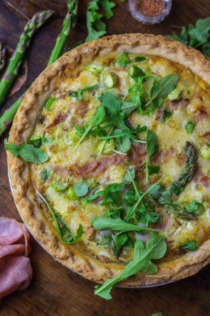 This Swiss, ham and asparagus quiche. It's the perfect brunchy food for spring. All the flavors pair so well together and it's super easy to make. I used a storebought pie crust then filled it to the brim with fresh asparagus, honey ham and Swiss cheese. Then, I beat an egg mixture and poured over the top. Baked and there you have it! It's super easy and can be served at so many types of occasions.