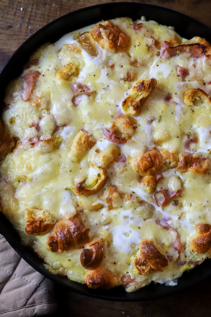 Ham and Swiss Croissant Breakfast Casserole: Savory Honey Ham, flakey croissants, sweet Swiss cheese all in one delicious, eggy bite!