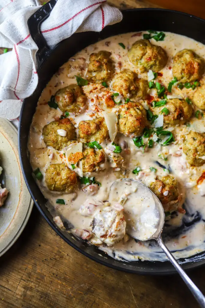 Ok y'all. Seriously. These Cajun meatballs with a spicy cream sauce. So delicious. These are made with chicken, so you'll use some ground chicken, breadcrumbs, Cajun holy trinity and spices. Make them into balls and bake. While you're at it, make this spicy cream sauce with heavy cream, parmesan, Rotel tomatoes and hot sauce. These are so delicious...Allen ranked them a 10!
