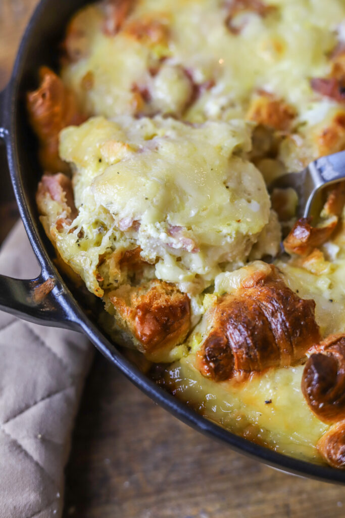 Ham and Swiss Croissant Breakfast Casserole: Savory Honey Ham, flakey croissants, sweet Swiss cheese all in one delicious, eggy bite!