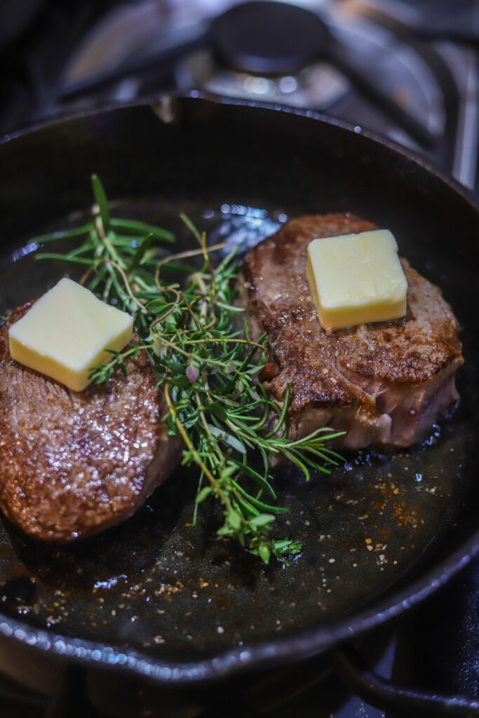 Can't beat an easy cast iron filet mignon. Takes less than 15 minutes to make them. You'll sear them super hot then add butter, garlic and a mix of herbs, pop them in the oven until your desired temp. They are so perfectly delicious, and seriously one of the easiest and quickest things to make.