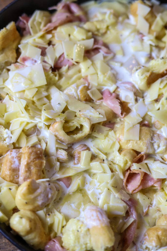 Ham and Swiss Croissant Breakfast Casserole: Savory Honey Ham, flakey croissants, sweet Swiss cheese all in one delicious, eggy bite!