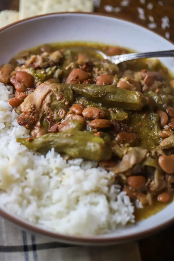 This crockpot speckled butter beans and okra stew is a classic dish that's super easy. You'll take some frozen butter beans and okra and dump them into a crockpot on low heat with some seasonings, veggies and bacon. Takes less than 5 minutes to put together. Let it slow cook for 5 hours for the easiest down-home meal.