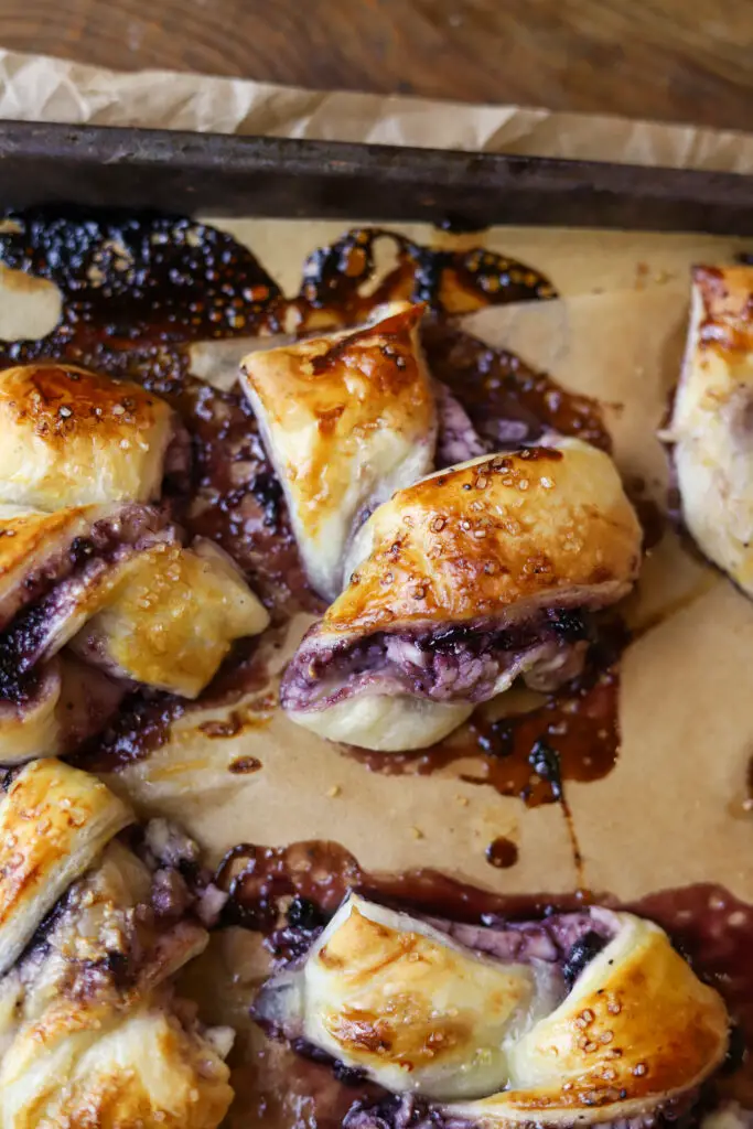 These blueberry cream cheese puff pastry knots are the perfect treat. These are so light and crisp with a gooey layer of blueberry jam and cream cheese swirled in the middle. These require so few ingredients and can be served as a breakfast, dessert or even just as a snack.