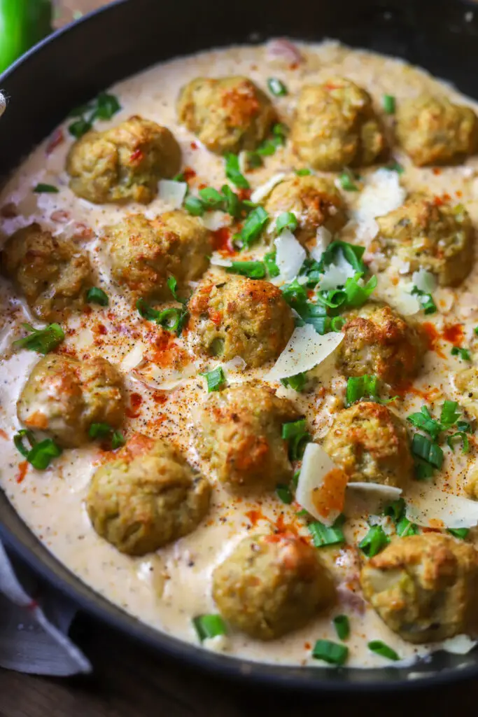 Ok y'all. Seriously. These Cajun meatballs with a spicy cream sauce. So delicious. These are made with chicken, so you'll use some ground chicken, breadcrumbs, Cajun holy trinity and spices. Make them into balls and bake. While you're at it, make this spicy cream sauce with heavy cream, parmesan, Rotel tomatoes and hot sauce. These are so delicious...Allen ranked them a 10!