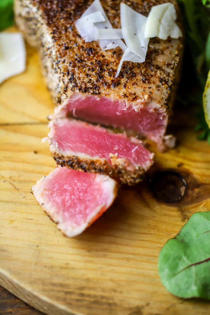 This pan seared tuna steak recipe with parmesan cream sauce. MMM. If you like seared tuna steak, this is it. This recipe seriously takes less than 10 minutes to make. You'll sear each side of the steaks then use the same skillet to make your sauce made of spices, parmesan cheese and heavy cream. This is a quick, easy and out of the ordinary kinda dinner recipe.