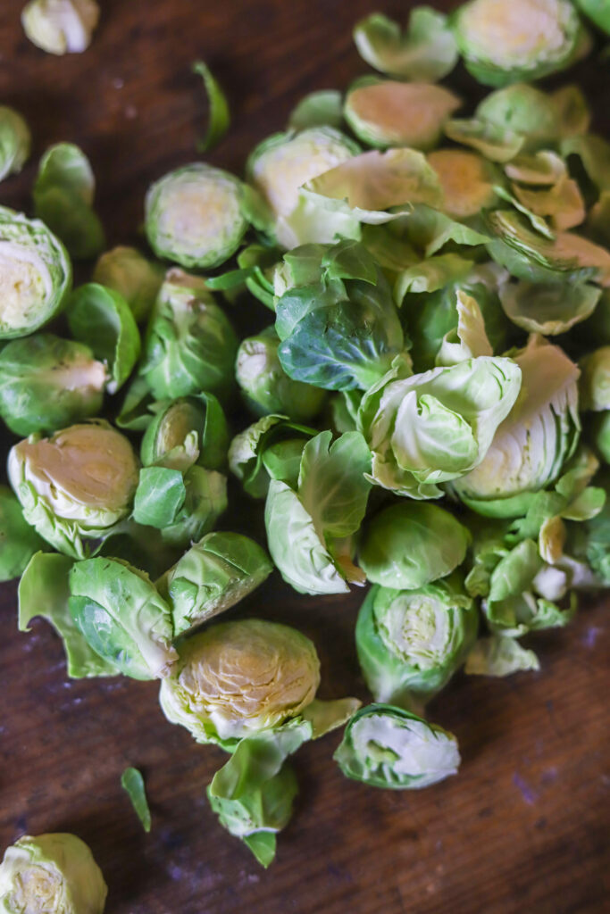 These pepper jelly caramelized brussel sprouts have become a favorite around here. They only require two ingredients along with some salt and pepper and that's it. You'll sauté the brussel sprouts in cast iron, then remove from heat and stir in some spicy pepper jelly. Taking less than 10 minutes to make, you seriously can't beat them. Plus, they are amazingly delicious.