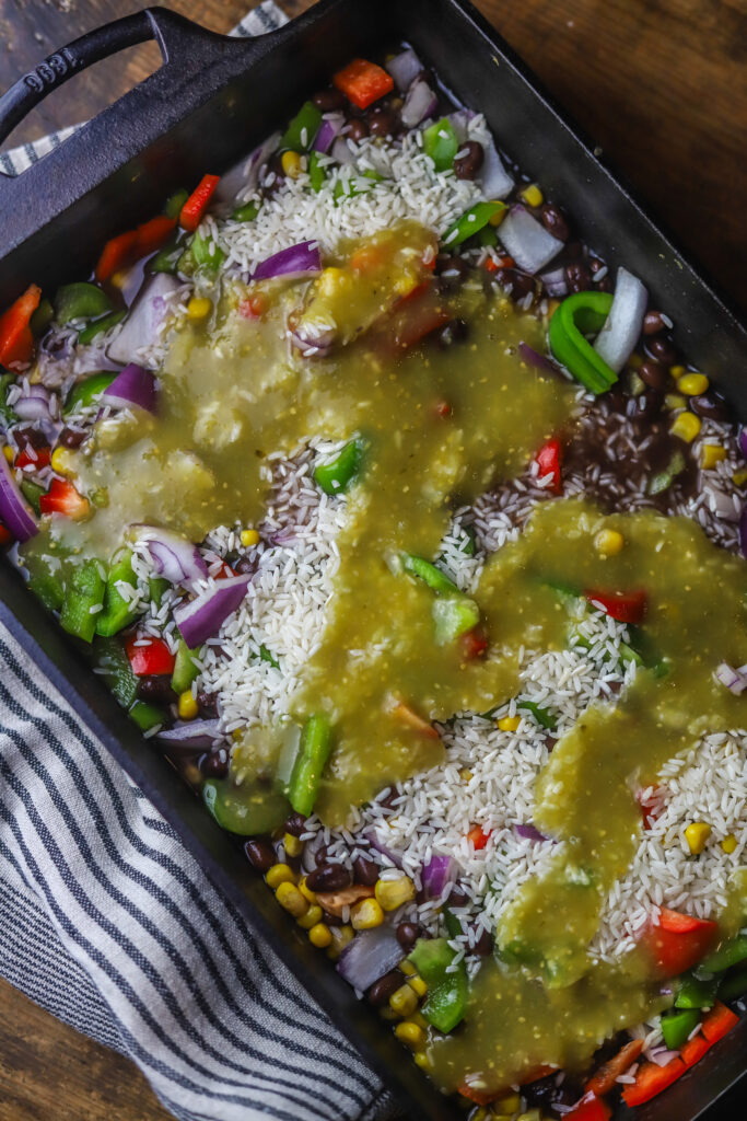 This salsa verde chicken casserole. So many delicious Mexican flavors. You'll add some rice, corn, black beans, vegetables and blackened chicken breasts to a casserole dish. Bake in a blend of spices, broth and salsa verde sauce until it all comes together. Lastly, top with more salsa verde and pepper jack cheese and broil until it becomes bubbly. This casserole is so simple and amazingly delicious.