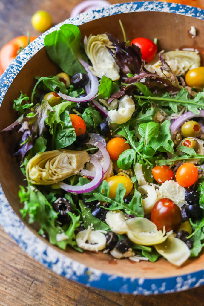 I love this simple chopped Italian salad. I'm always looking for different ways to make a salad, especially in the summer months. This is no complicated or secret to making this one. Just chop up all the veggies and add them over a bed of spring mixed greens and dress with your favorite Italian dressing.