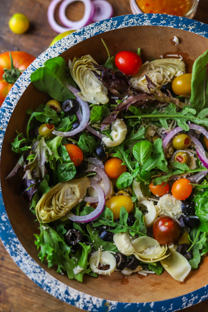 I love this simple chopped Italian salad. I'm always looking for different ways to make a salad, especially in the summer months. This is no complicated or secret to making this one. Just chop up all the veggies and add them over a bed of spring mixed greens and dress with your favorite Italian dressing.