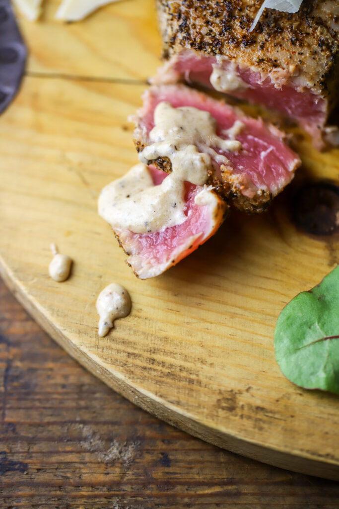 This pan seared tuna steak recipe with parmesan cream sauce. MMM. If you like seared tuna steak, this is it. This recipe seriously takes less than 10 minutes to make. You'll sear each side of the steaks then use the same skillet to make your sauce made of spices, parmesan cheese and heavy cream. This is a quick, easy and out of the ordinary kinda dinner recipe.