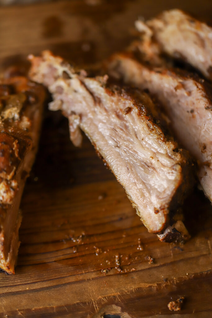 These slow cooker pork spare ribs with this homemade rib rub. You won't want to make ribs any other way. It's so simple, and you practically only need two ingredients, plus your seasonings. Mix your rub together, rub it on the ribs, add them and a can of coke to the crockpot and slow cook for 6 hours. These make the simplest and juiciest ribs for your next cookout or summer event. 