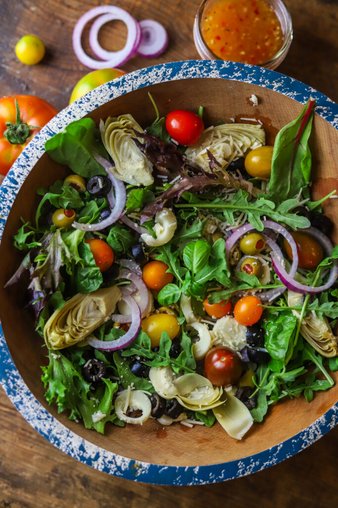 I love this simple chopped Italian salad. I'm always looking for different ways to make a salad, especially in the summer months. This is no complicated or secret to making this one. Just chop up all the veggies and add them over a bed of spring mixed greens and dress with your favorite Italian dressing.