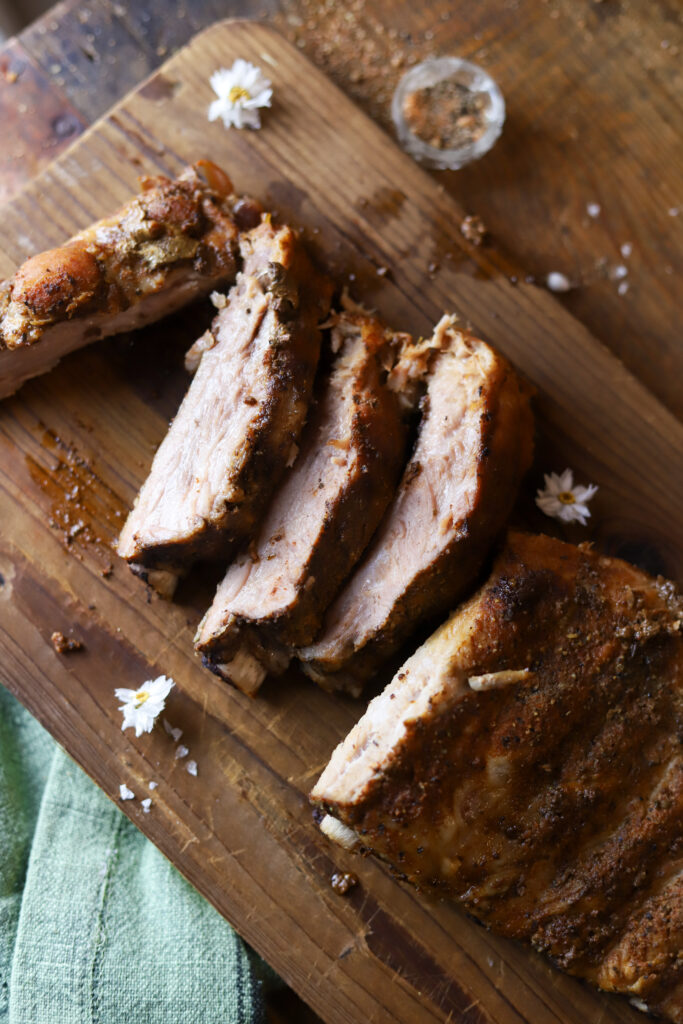 These slow cooker pork spare ribs with this homemade rib rub. You won't want to make ribs any other way. It's so simple, and you practically only need two ingredients, plus your seasonings. Mix your rub together, rub it on the ribs, add them and a can of coke to the crockpot and slow cook for 6 hours. These make the simplest and juiciest ribs for your next cookout or summer event. 