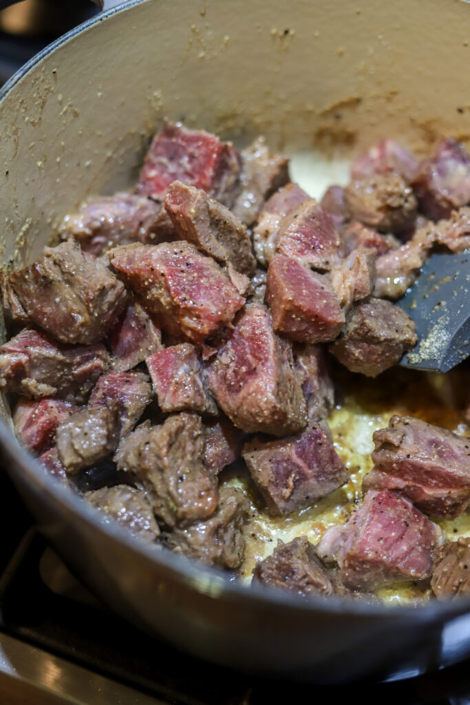 These Mississippi pot roast style beef tips are so tender and rich. These are just beef tips cooked like the popular Mississippi pot roast. It's butter, ranch seasonings, beef gravy, pepperoncini pepper all cooked together with some juicy beef tips. Buy cut beef tips in the store or buy a roast and cut into pieces like I did. Either way, this recipe is simple and delicious and takes less than an hour to make.