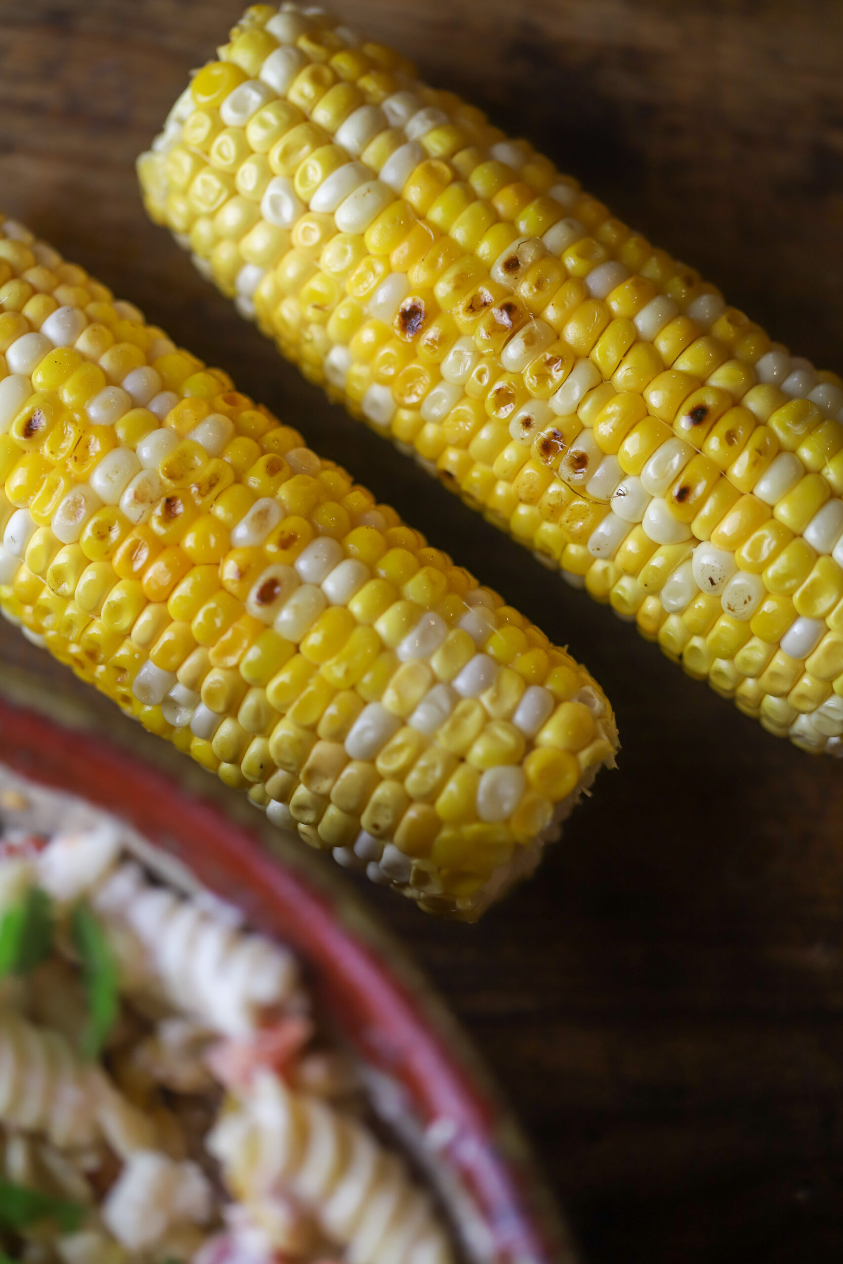 You'll love this Mexican street corn pasta salad. It's a mix of rotini pasta, two types of roasted corn, a can of Rotel tomatoes, Cotija cheese and a spicy dressing. This is such a fun, delicious and simple way to make pasta salad, and there are so many ways to serve it.