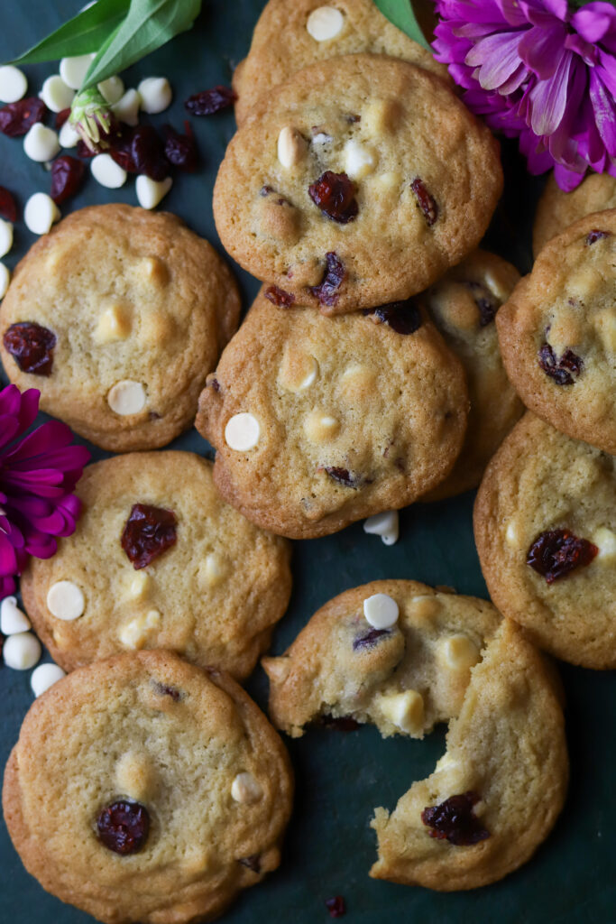 These white chocolate cranberry cookies are so perfect and delicious. These are made just like a traditional chocolate chip cookie, but they are full of white chocolate chips and dried cranberries. These are so chewy and delicious and perfect for any occasion.