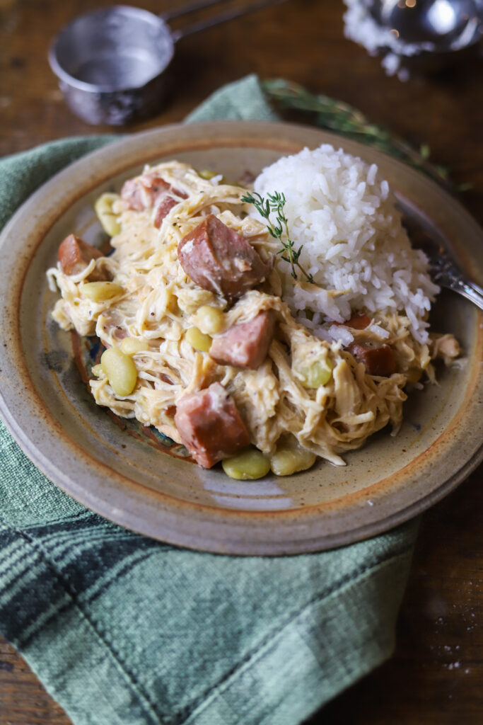 This crockpot smothered chicken with sausage and lima. Ok. This is really just a throw it all in the crockpot, easy, southern comfort dish. You'll slow cook some chicken, sausage and lima beans together all day, and right before serving, mix up a homemade gravy and pour it in. This is recipe is extremely easy and so delicious. 