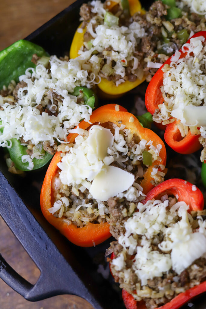 These dirty rice stuffed peppers are a perfect comfort meal. You can't beat a Louisiana dirty rice stuffed into sweet bell peppers. I added some Monterrey and Pepper Jack cheeses for added flavor. This is an amazingly delicious twist on a traditional stuffed pepper recipe. 