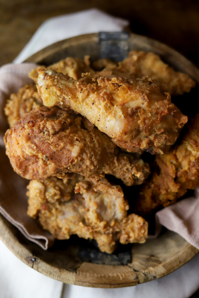 These are seriously the best fried chicken legs. Frying chicken does not have to be that complicated. I fry my chicken the old-fashioned way, in a big, Dutch oven. All you need for this recipe some chicken legs, a good breading, some old and a little patience. These come out perfectly crispy and juicy on the inside.