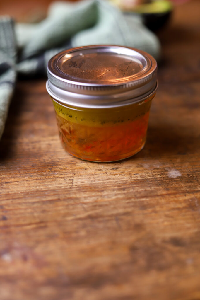 This strawberry pecan salad with pepper jelly vinaigrette is literally so good. You can also make this salad any time of year. All you’re going to need is a bed of greens, some strawberries, feta cheese, roasted pecans and then make this homemade vinaigrette made with pepper jelly. It’s so simple to make and delicious.