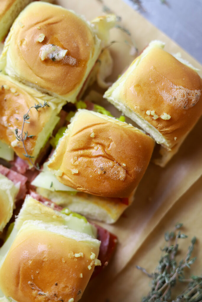 I love this hot Italian sliders recipe. You can make a meal out of these or make them as an appetizer. These are simple. They’re just pepperoni, salami, provolone and banana peppers in some Hawaiian rolls. You’ll love these; I promise.