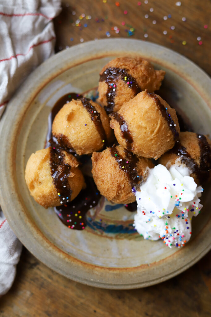 These deep fried cake bites are seriously what dreams are made of. Kind of like a funnel cake, you’ll take a box of cake mix and prepare it accordingly. Add in more flour then take a cookie scoop and drop it in some hot oil until nice and golden. Serve warm with any of your favorite toppings. These are seriously the bomb. 