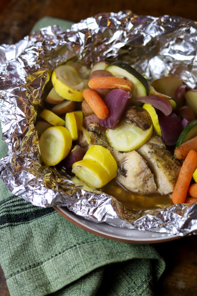 These easy baked chicken foil packets are one of my favorite dinner go-to's. All you do is place your chicken, vegetables and some seasoning in some foil. Wrap it up, and let it bake. It's so simple and cleanup is a breeze. The chicken comes out so tender, and the flavors of all the veggies create the most delicious flavor.