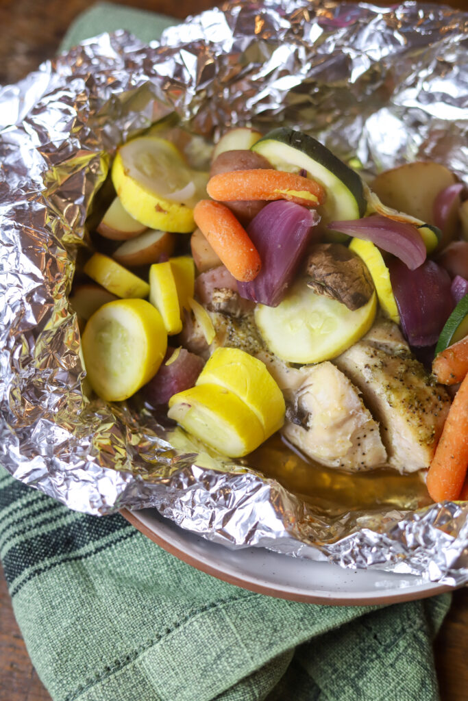 These easy baked chicken foil packets are one of my favorite dinner go-to's. All you do is place your chicken, vegetables and some seasoning in some foil. Wrap it up, and let it bake. It's so simple and cleanup is a breeze. The chicken comes out so tender, and the flavors of all the veggies create the most delicious flavor.