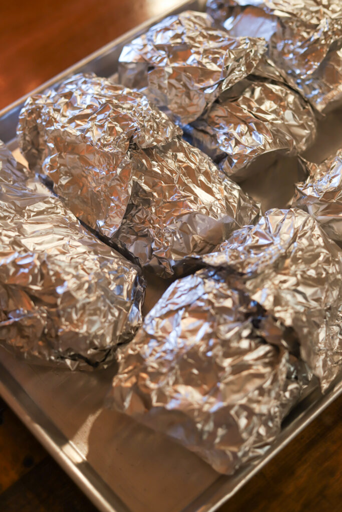 These easy baked chicken foil packets are one of my favorite dinner go-tos. All you do is place your chicken, vegetables and some seasoning in some foil. Wrap it up, and let it bake. It's so simple and cleanup is a breeze. The chicken comes out so tender, and the flavors of all the veggies create the most delicious flavor.