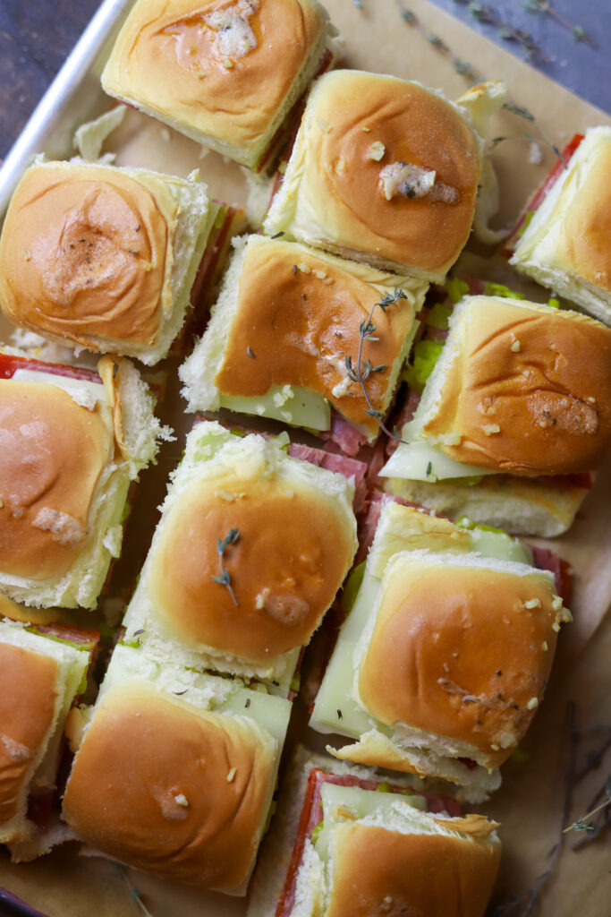 I love this hot Italian sliders recipe. You can make a meal out of these or make them as an appetizer. These are simple. They’re just pepperoni, salami, provolone and banana peppers in some Hawaiian rolls. You’ll love these; I promise.