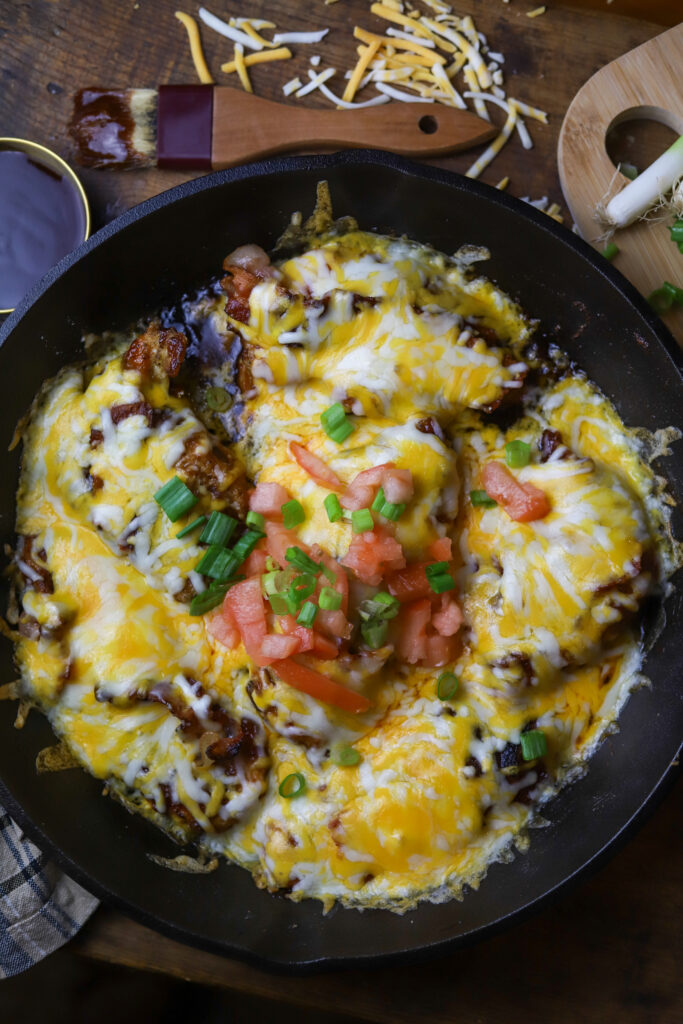 This Monterey chicken skillet is a perfect dinner idea. It's a pan-fried chicken breast, smothered in barbeque sauce, baked and them topped with a blend of cheese and bacon. This is really taking a simple chicken breast and kicking it up a notch. This easy dinner is something different that's packed with flavor.