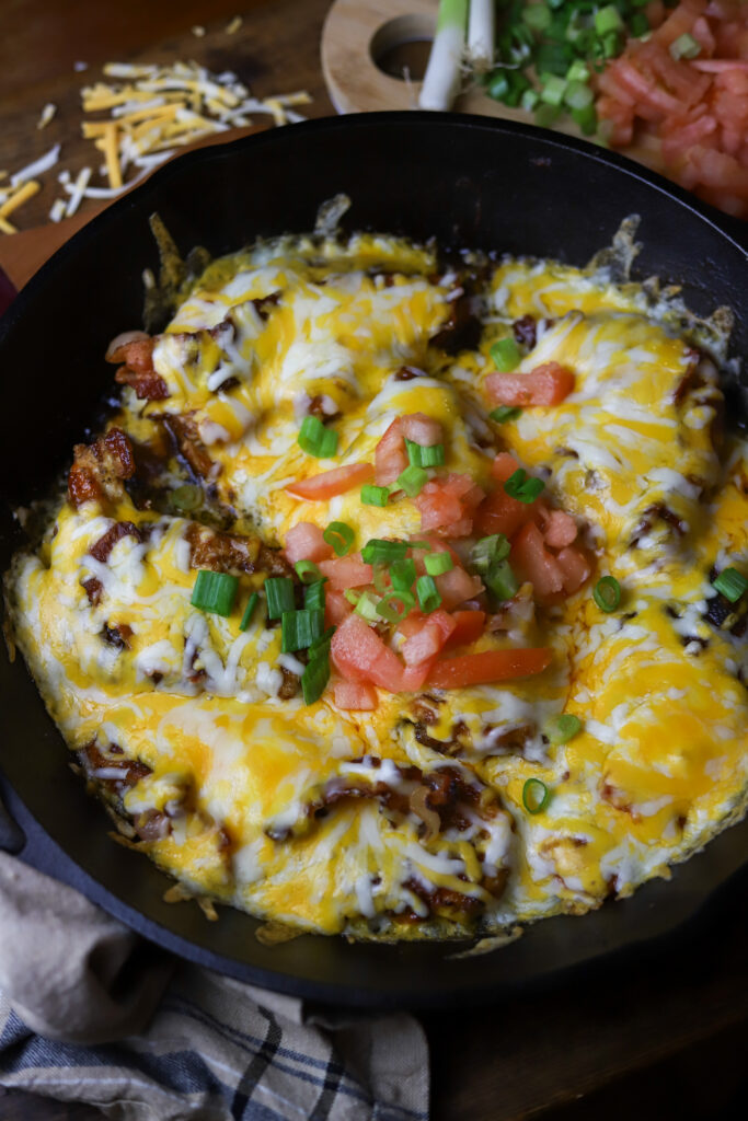 This Monterey chicken skillet is a perfect dinner idea. It's a pan-fried chicken breast, smothered in barbeque sauce, baked and them topped with a blend of cheese and bacon. This is really taking a simple chicken breast and kicking it up a notch. This easy dinner is something different that's packed with flavor.