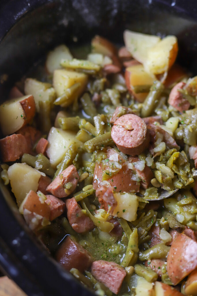 This slow cooker ranch sausage potatoes and green beans recipe is the easiest dinner. You have it all. Meat, potatoes and a vegetable. Literally, throw all the ingredients in your crockpot and let them cook on high for at least 5 hours. This is the simplest, no-brainer meal.