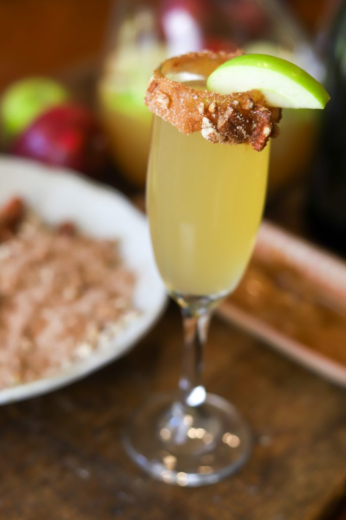 Indulge in the flavors of autumn with our Caramel Apple Mimosa, a must-try for any fall celebration.