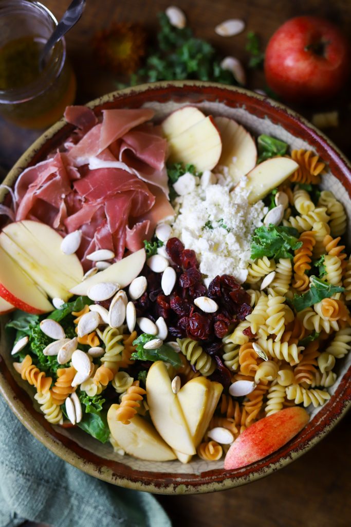 Enjoy a burst of autumn flavors with this fall pasta salad, packed with pastas, apples, savory prosciutto and feta, crunchy seeds and a sweet maple dressing.