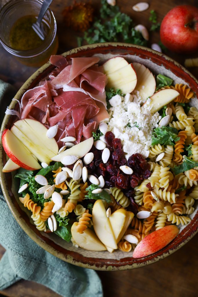 Enjoy a burst of autumn flavors with this fall pasta salad, packed with pastas, apples, savory prosciutto and feta, crunchy seeds and a sweet maple dressing.